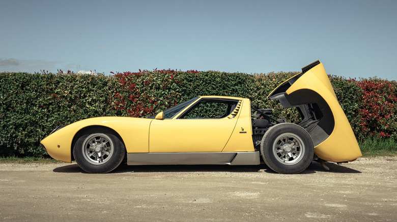 Side view of the Lamborghini Miura SV, with its engine cover open.