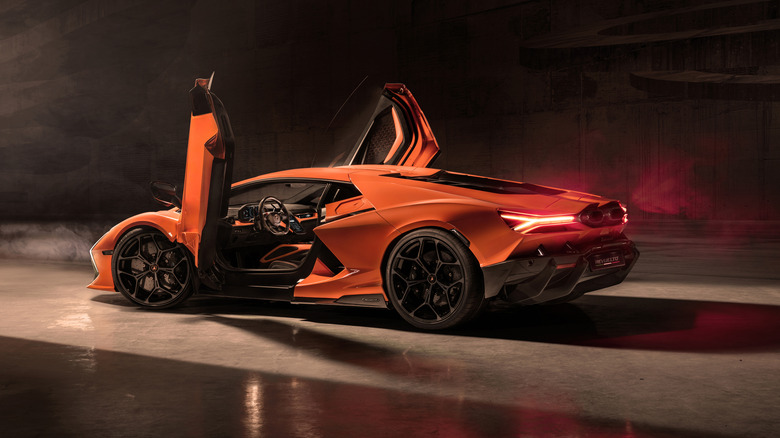 A lovely orange Lamborghini Aventador Revuelto with moody lighting.