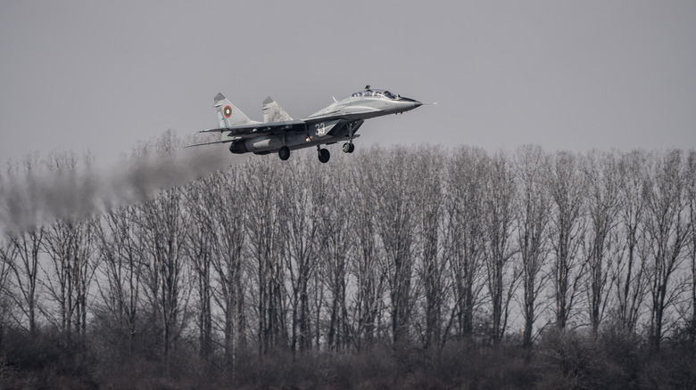 MiG-19 flying low over ground