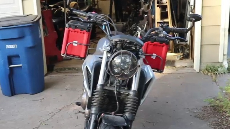 A motorcycle fitted with Milwaukee Packout boxes.