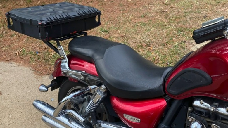 A Milwaukee Packout box attached to the rear of a motorcycle.