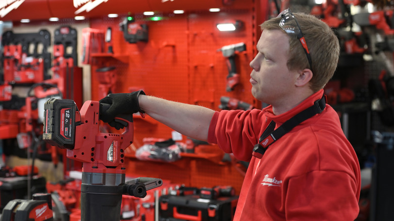 Milwaukee representative demonstrating a power tool