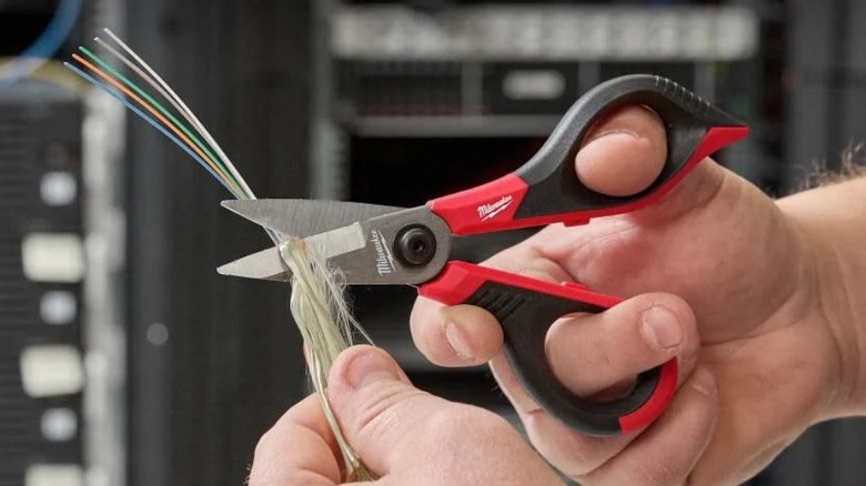 Person using Milwaukee Kevlar Shears