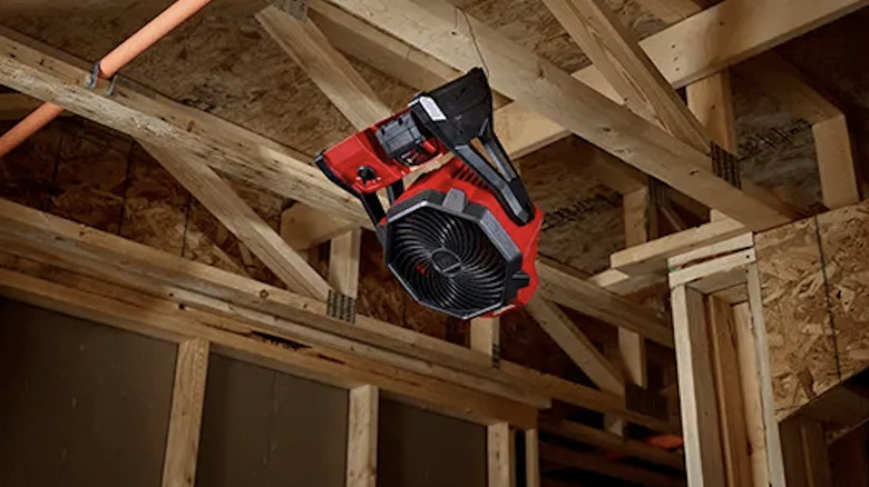 M18 Jobsite Fan hanging from rafters