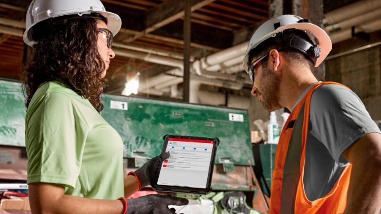 People looking at tablet with One-Key