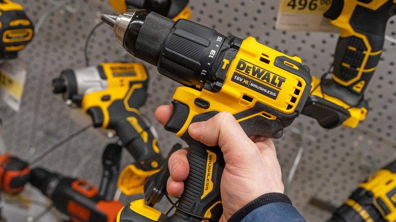 Holding DeWalt drill in store