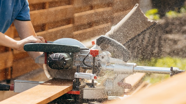 table saw cutting wood