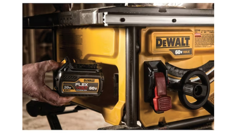 60V battery being inserted into DeWalt Flexvolt 60V Max Table Saw