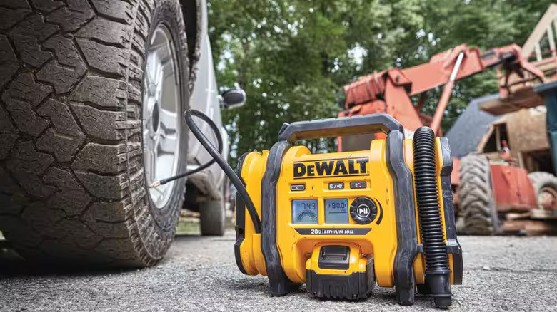 DeWalt inflator attached to a tire