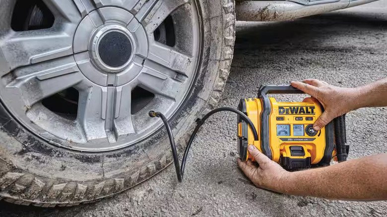 DeWalt inflator connected to a tire