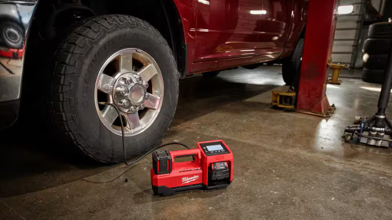 Milwaukee inflator attached to a tire