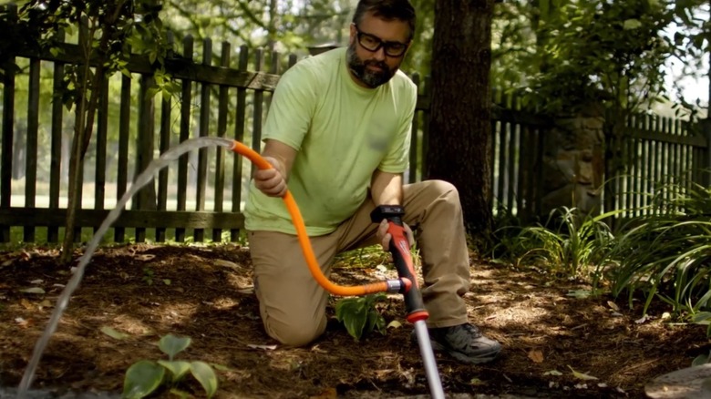 Milwaukee stick pump in yard