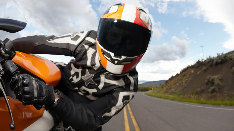 Person on a racing motorcycle in full gear