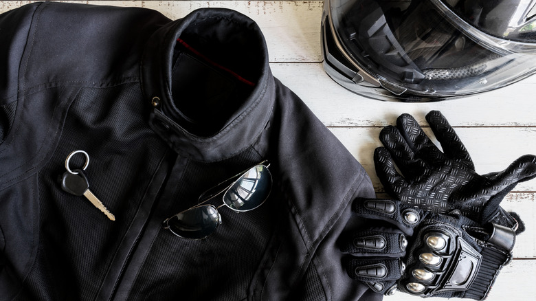 Motorcycle jacket, gloves, helmet, glasses, and keys