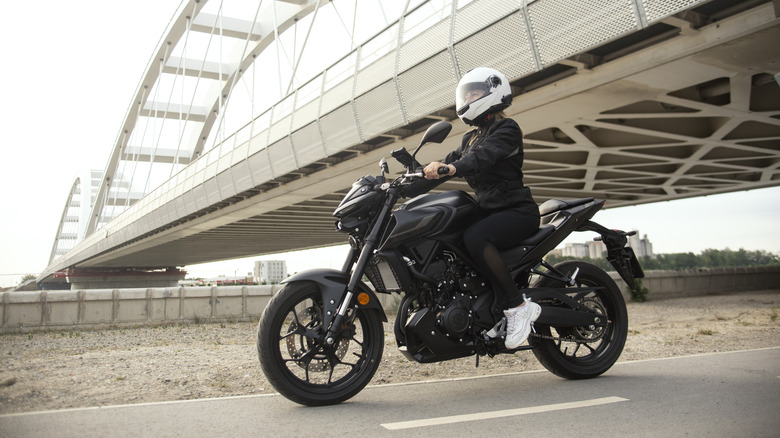 Person riding a black motorcycle