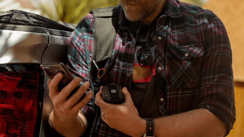 Person using a Motorla Defy Satellite Link