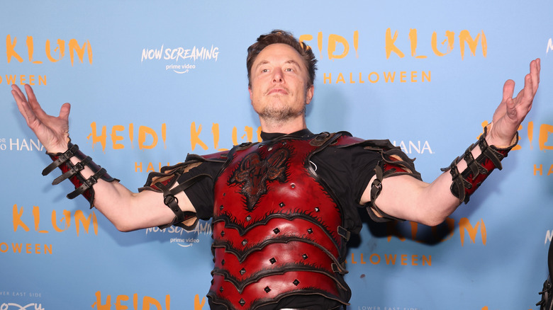 Elon Musk posing in a Halloween costume.