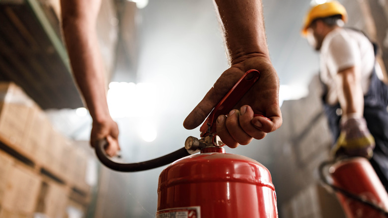 workers hardhats fire extinguishers