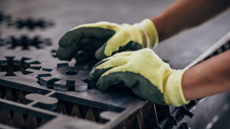 hands in safety gloves