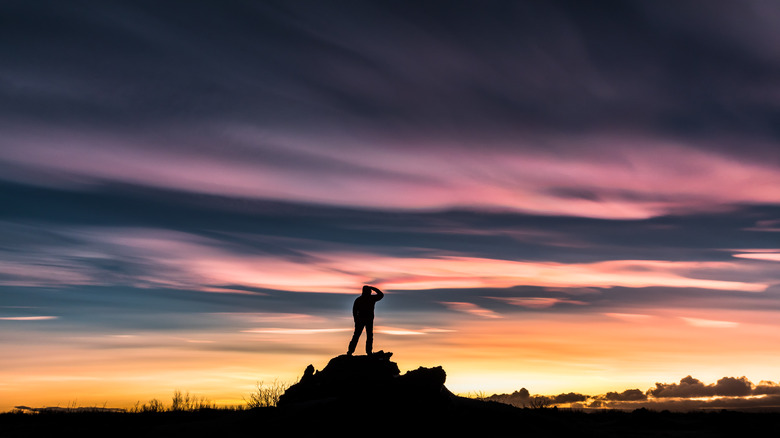 Person looking at nacreous clouds