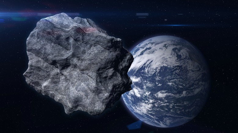 Asteroid and Earth concept image