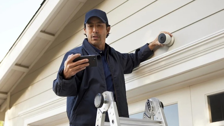 Man installing Nest camera