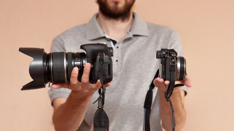 Man holds camera