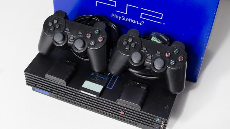 Playstation 2 on display with controllers 