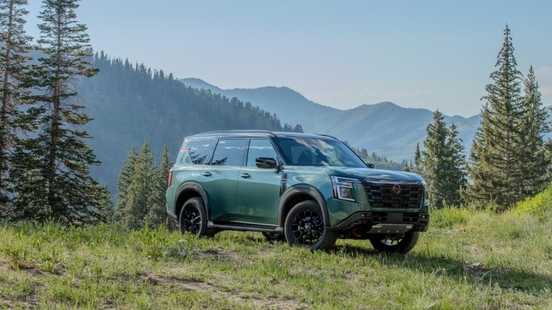 2025 Nissan Armada PRO-4X parked off-road with mountains in the background