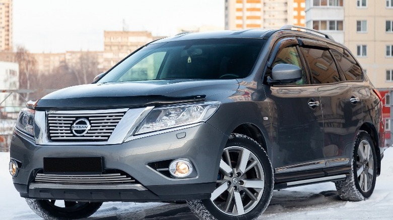 gray nissan pathfinder parked snow