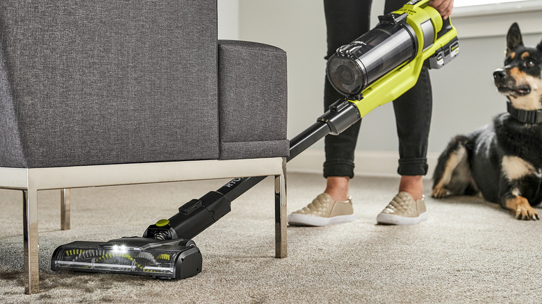 person cleaning floor Ryobi Pet Stick