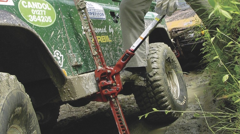 Using a Hi-Lift jack to raise an off-road vehicle on the trail