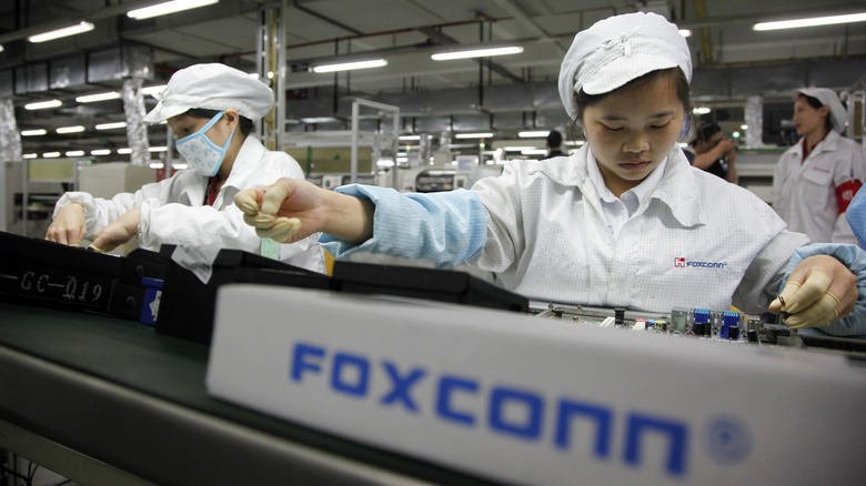 Foxconn workers on assembly line