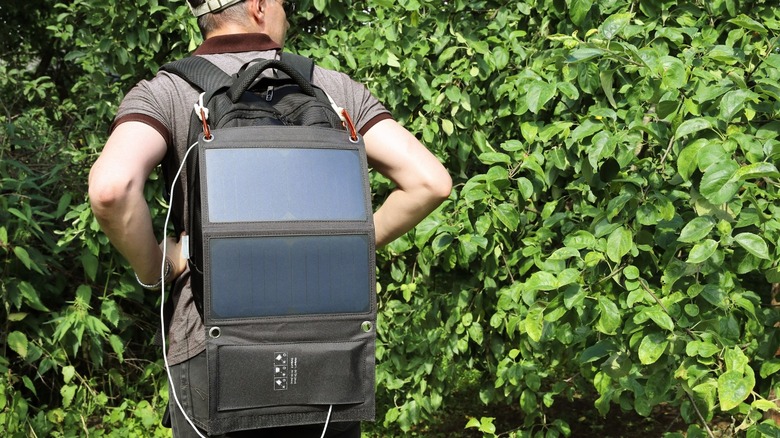 Solar panel hanging off backpack