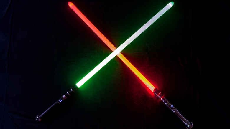 green and red crossed lightsabers