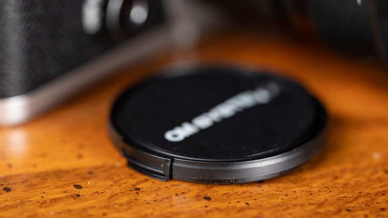 Lens cap for the OM Systems M.ZUIKO Digital ED 25mm f1.8 II lens.