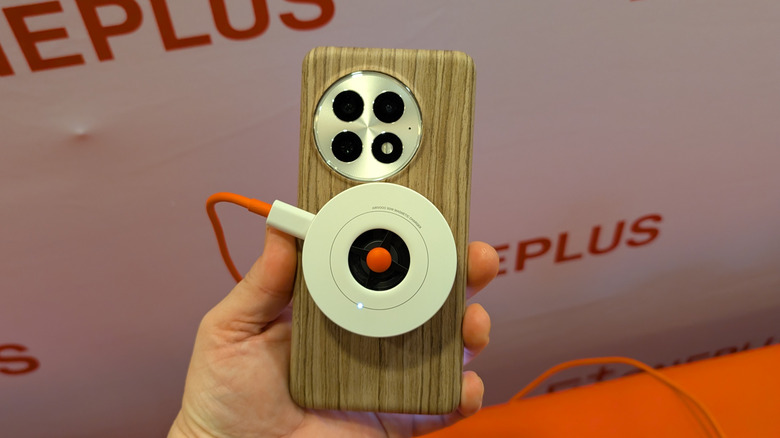 OnePlus 13 with a wireless charger