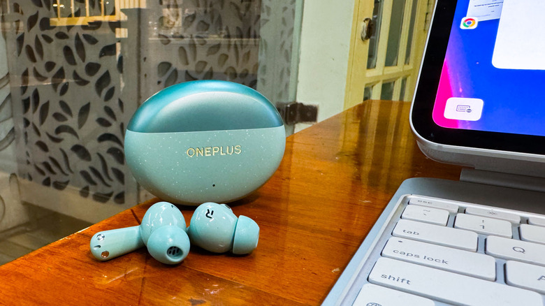 OnePlus Nord Buds 3 Pro earbuds on table near ipad