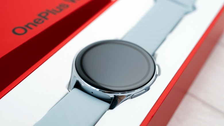 The OnePlus Watch outside its box.
