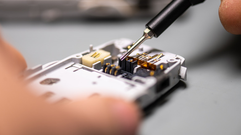 Repairman fixing a phone