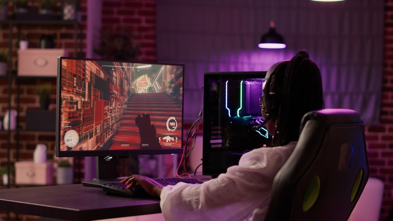 Woman playing games on PC