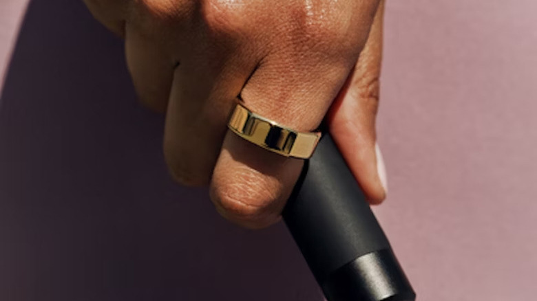 person holding jumprope handle while wearing an Oura Ring