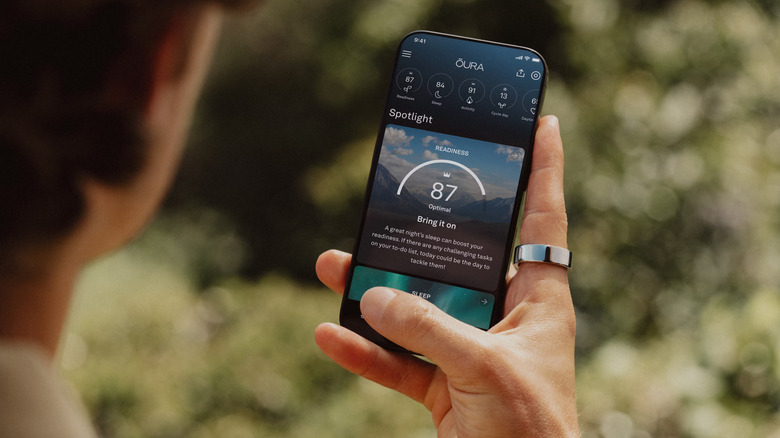 person using Oura app