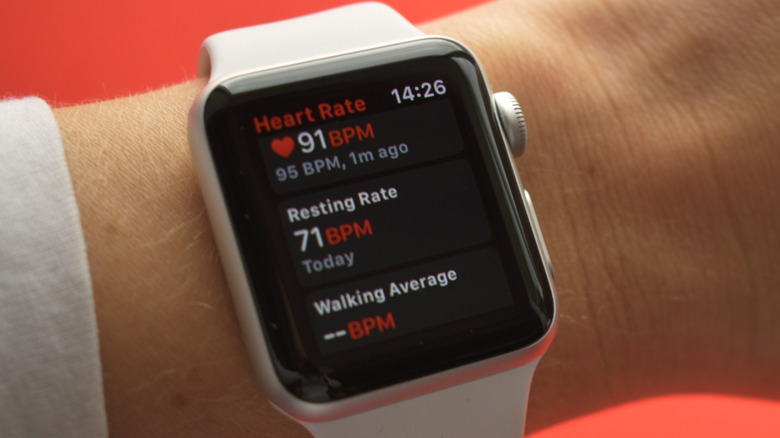 Person wearing an Apple Watch Series 3 smartwatch