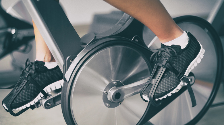 Person riding exercise bike