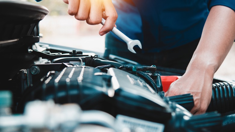 person working on car