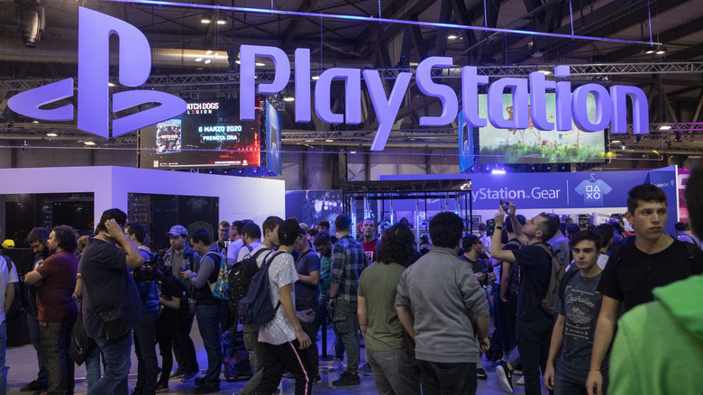 Milan Games Week 2019 attendees walking past PlayStation logo