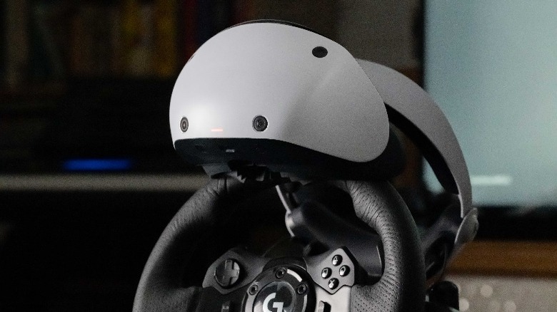 PlayStation VR2 set on steering wheel