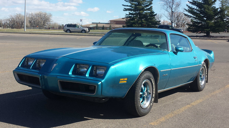 Blue 1979 Pontiac Firebird parked