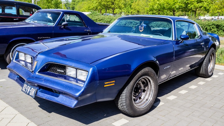 Blue Pontiac Firebird parked